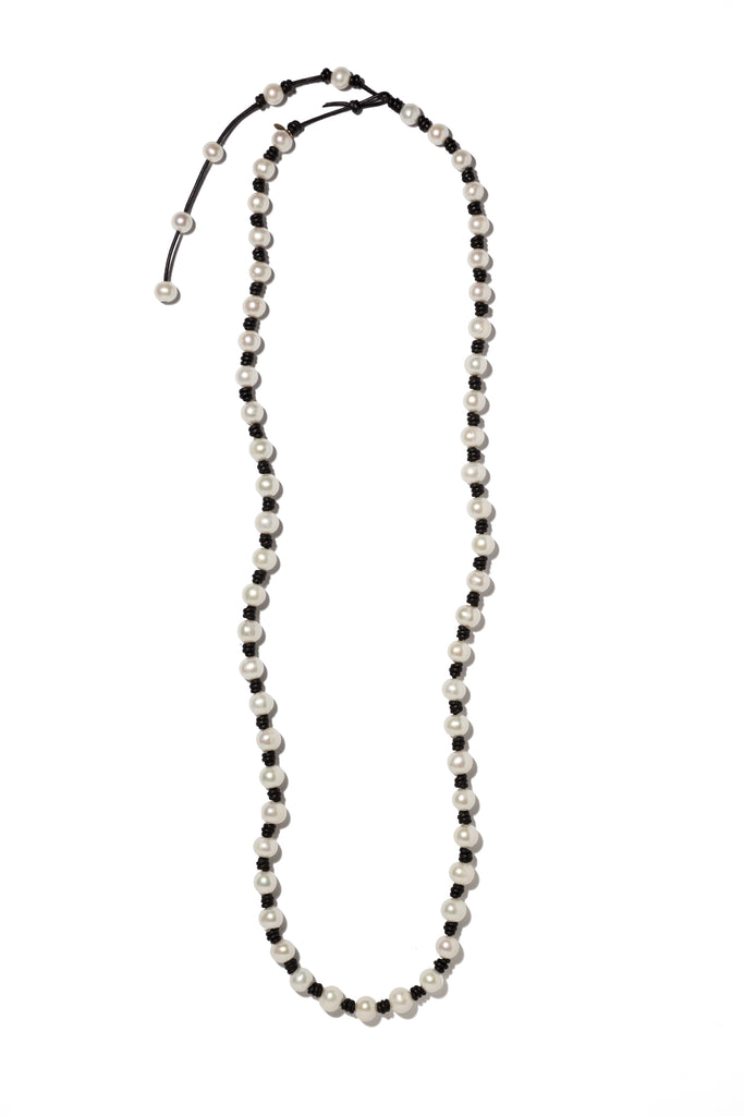Long knotted large pearl & leather necklace with tail